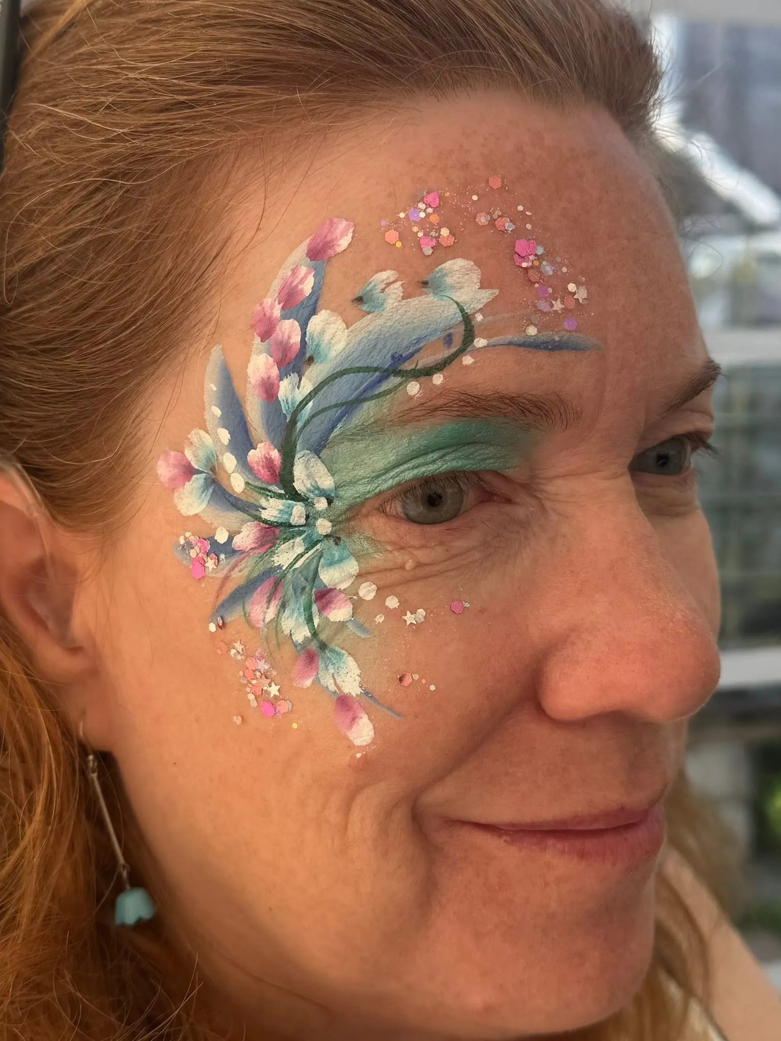 Woman with a blue and white swirl eye design