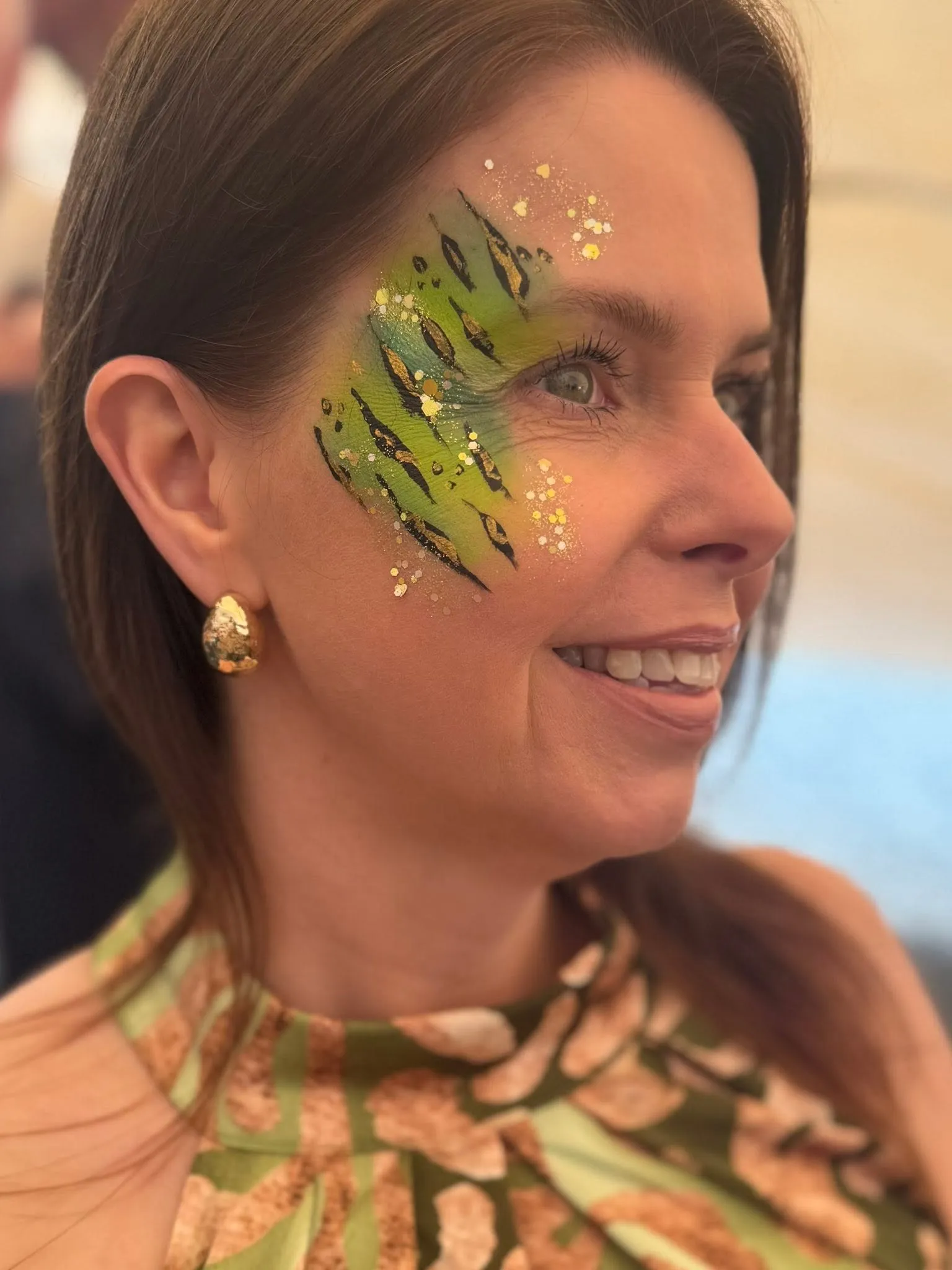 Woman with a green leaf eye design