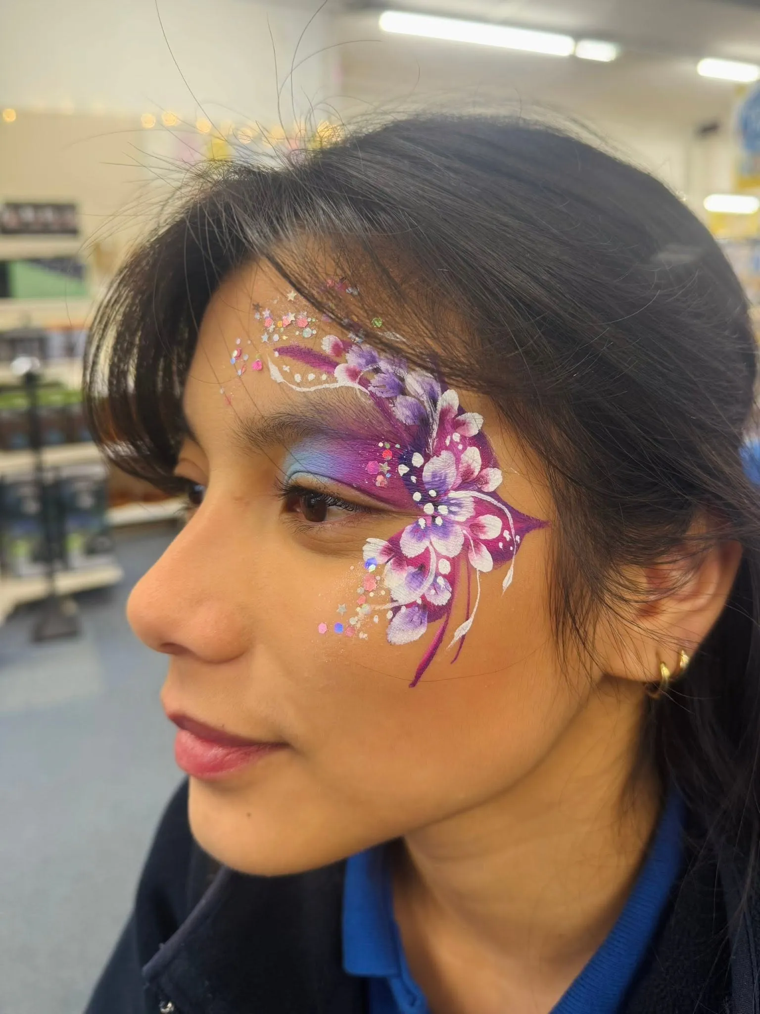 Woman with pink flowers and gems on her temple