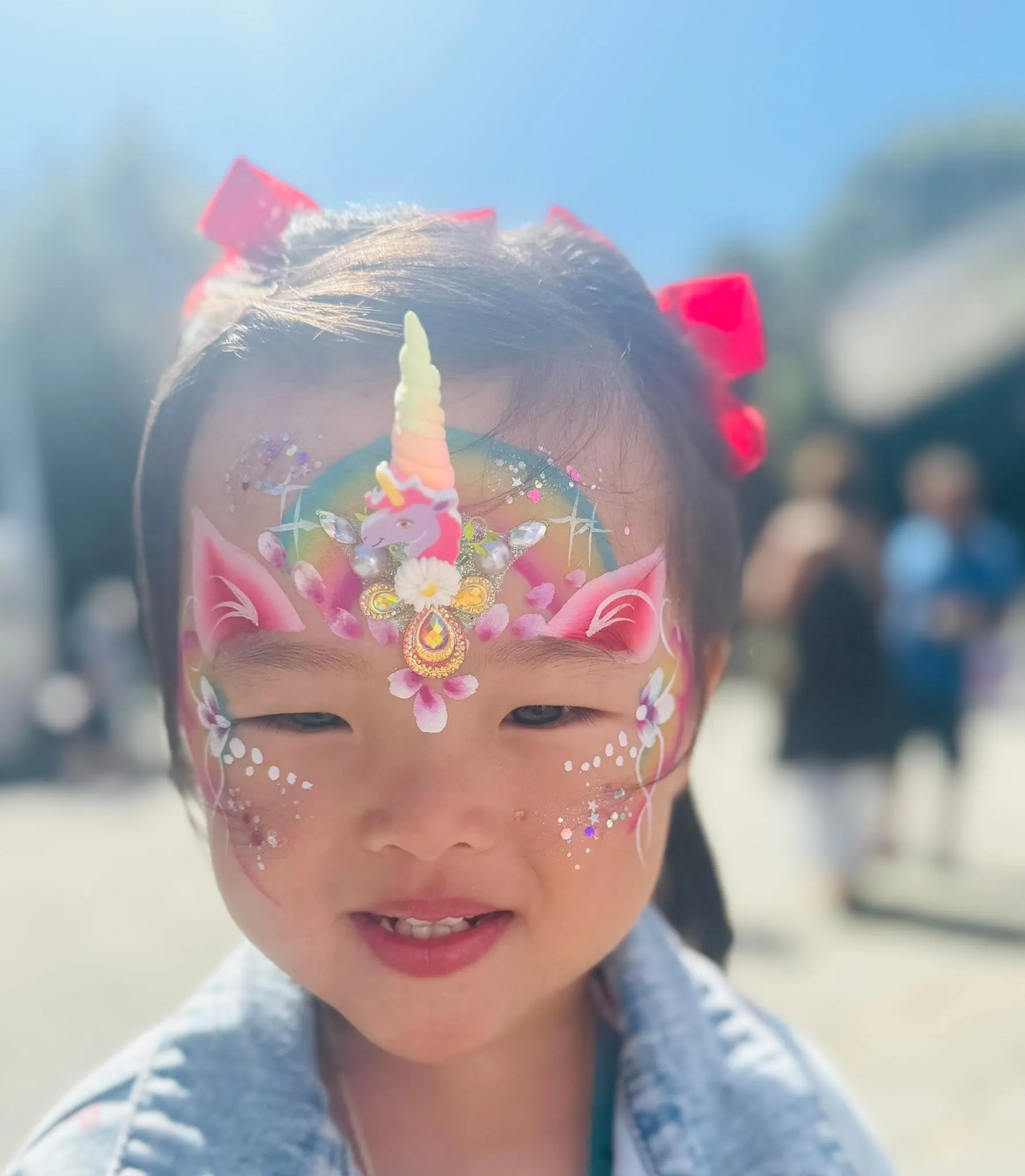 Girl with a pastel unicorn crown and gems
