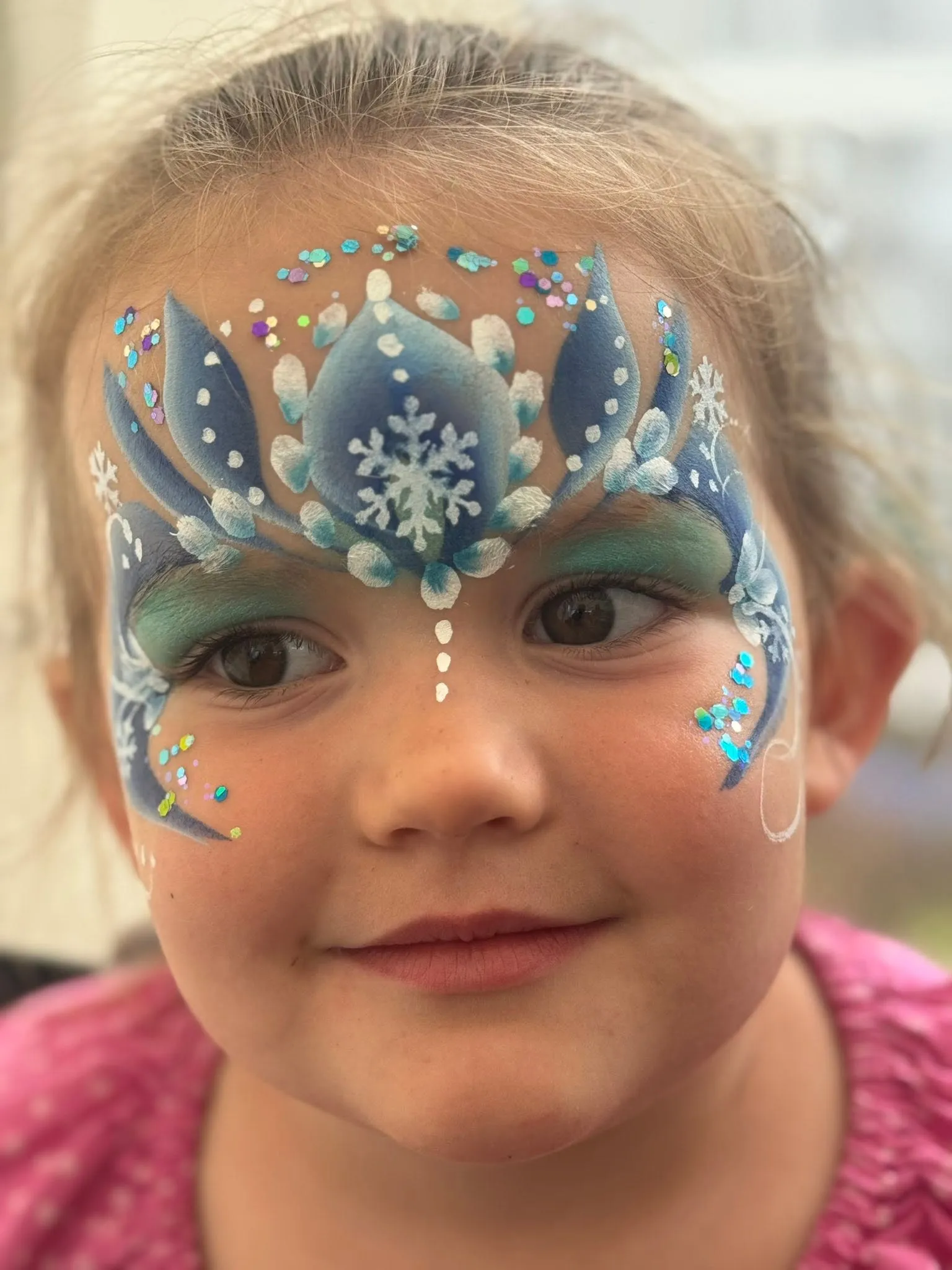Girl with a blue snow queen crown and gems