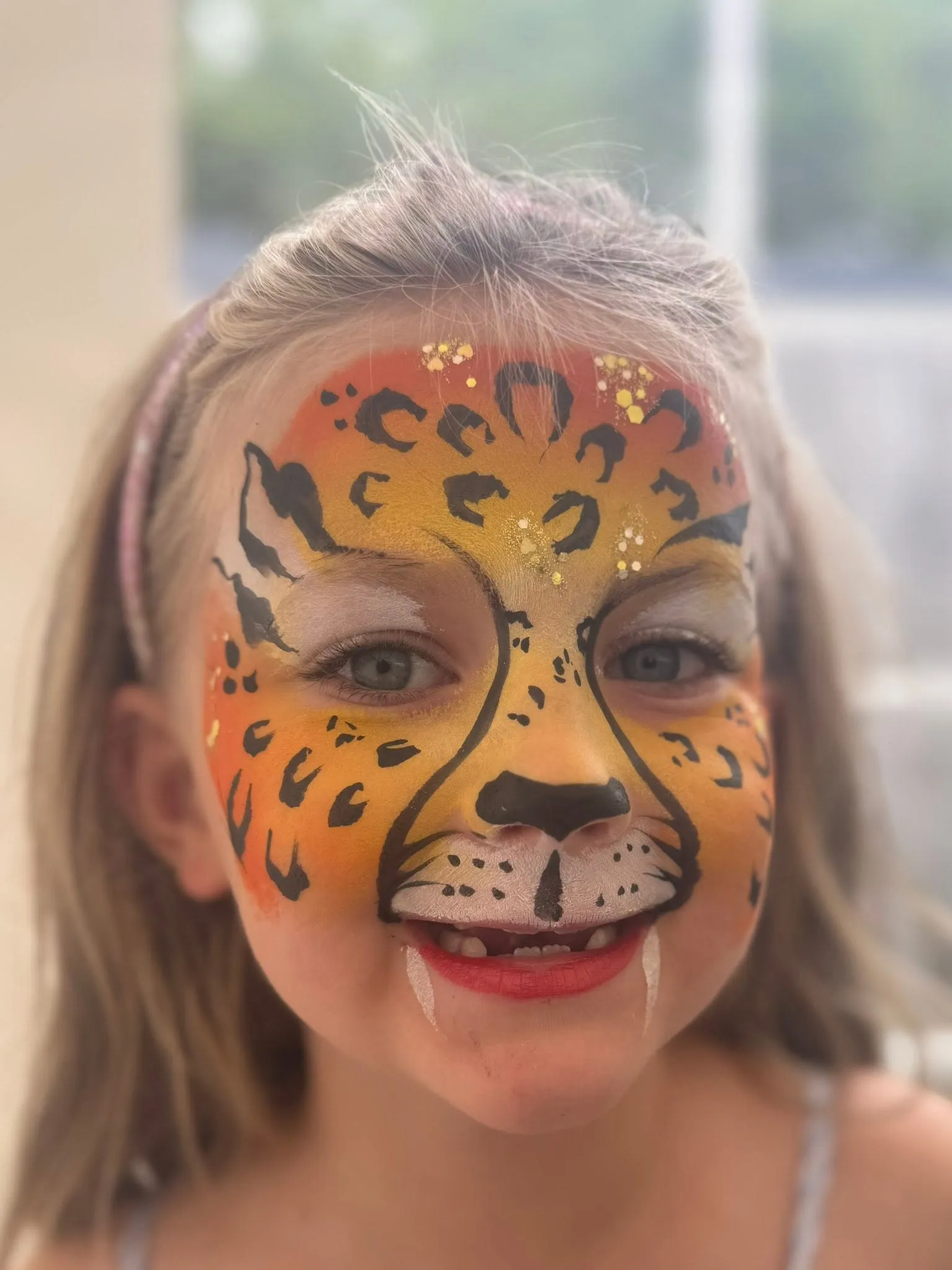 Girl with a full leopard face