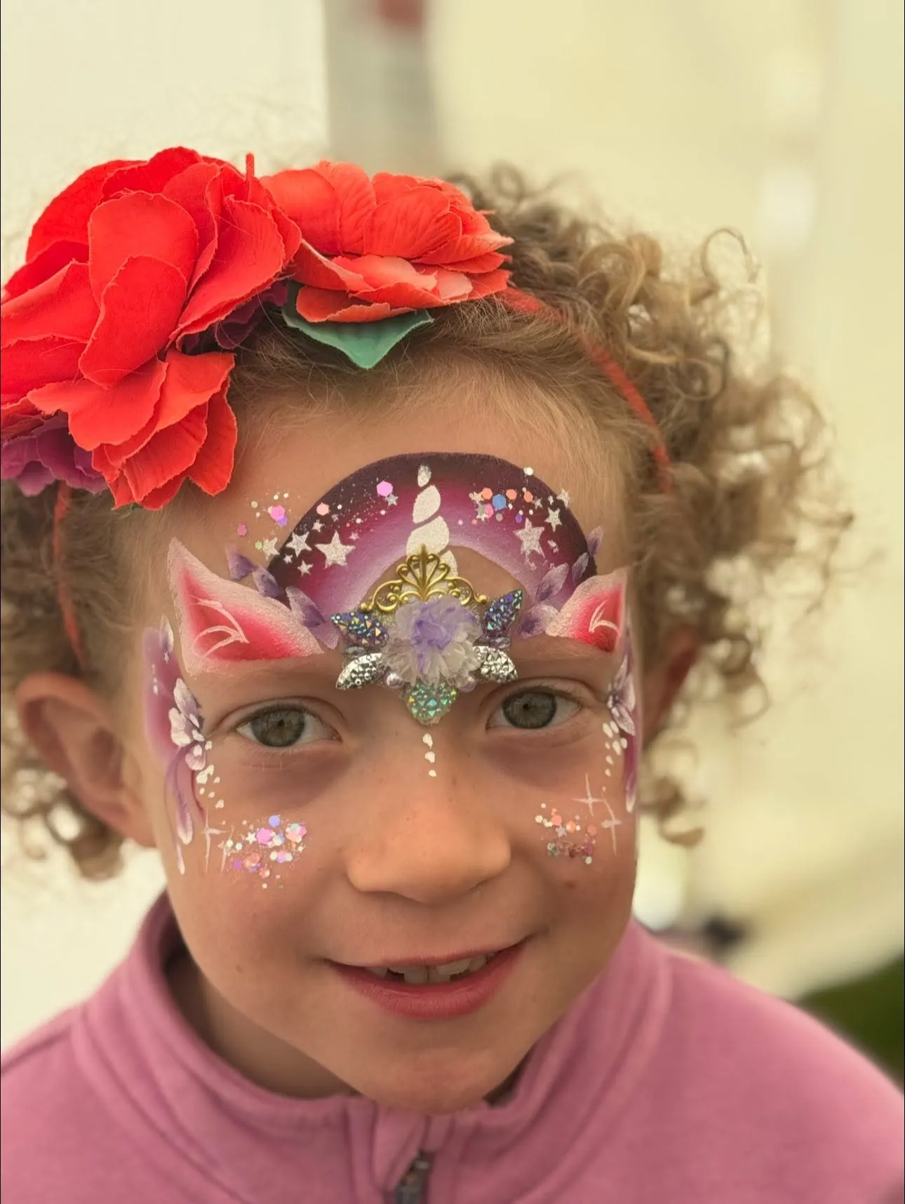 Girl with a unicorn face and red flower