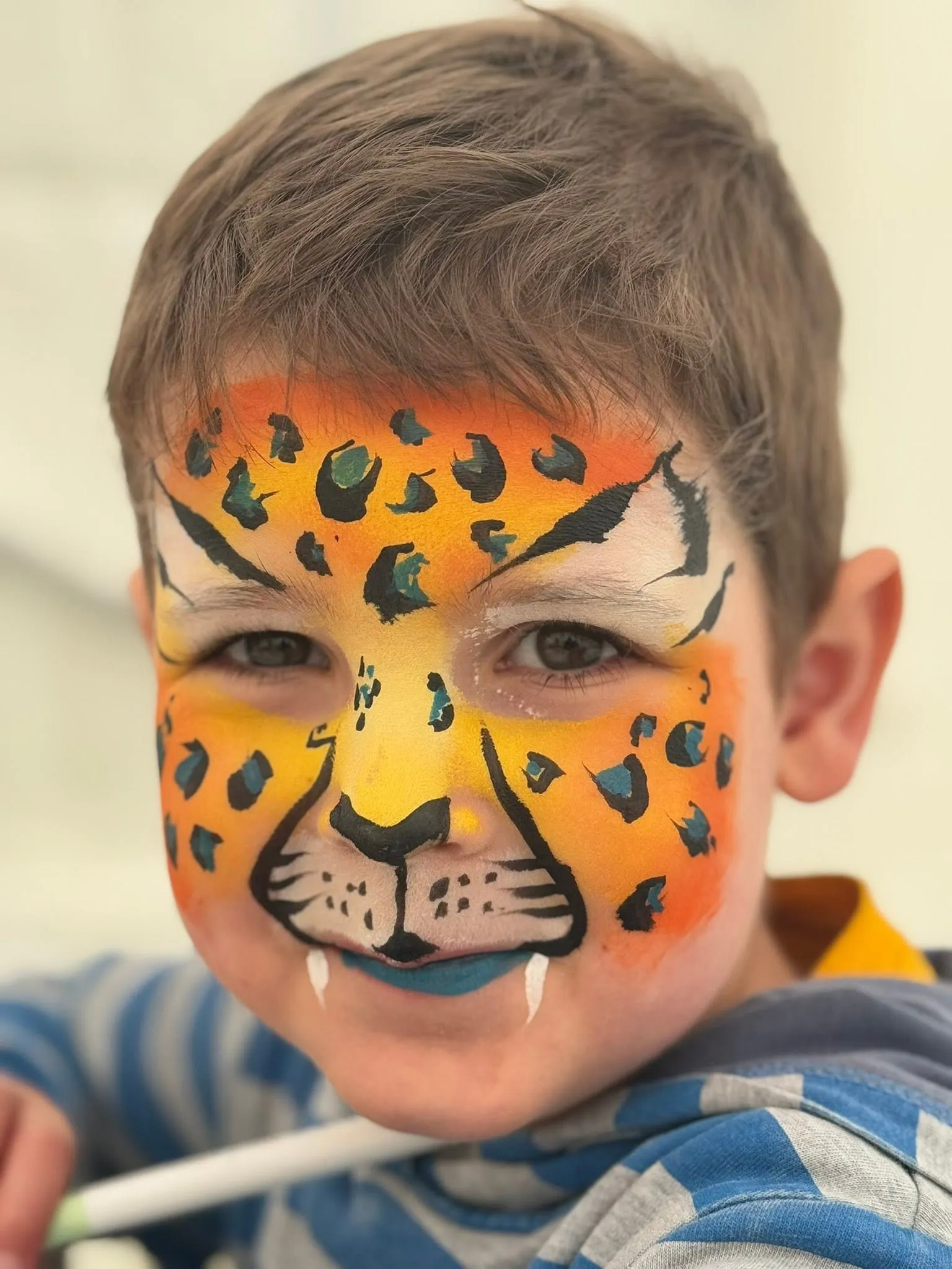 Boy with a leopard face