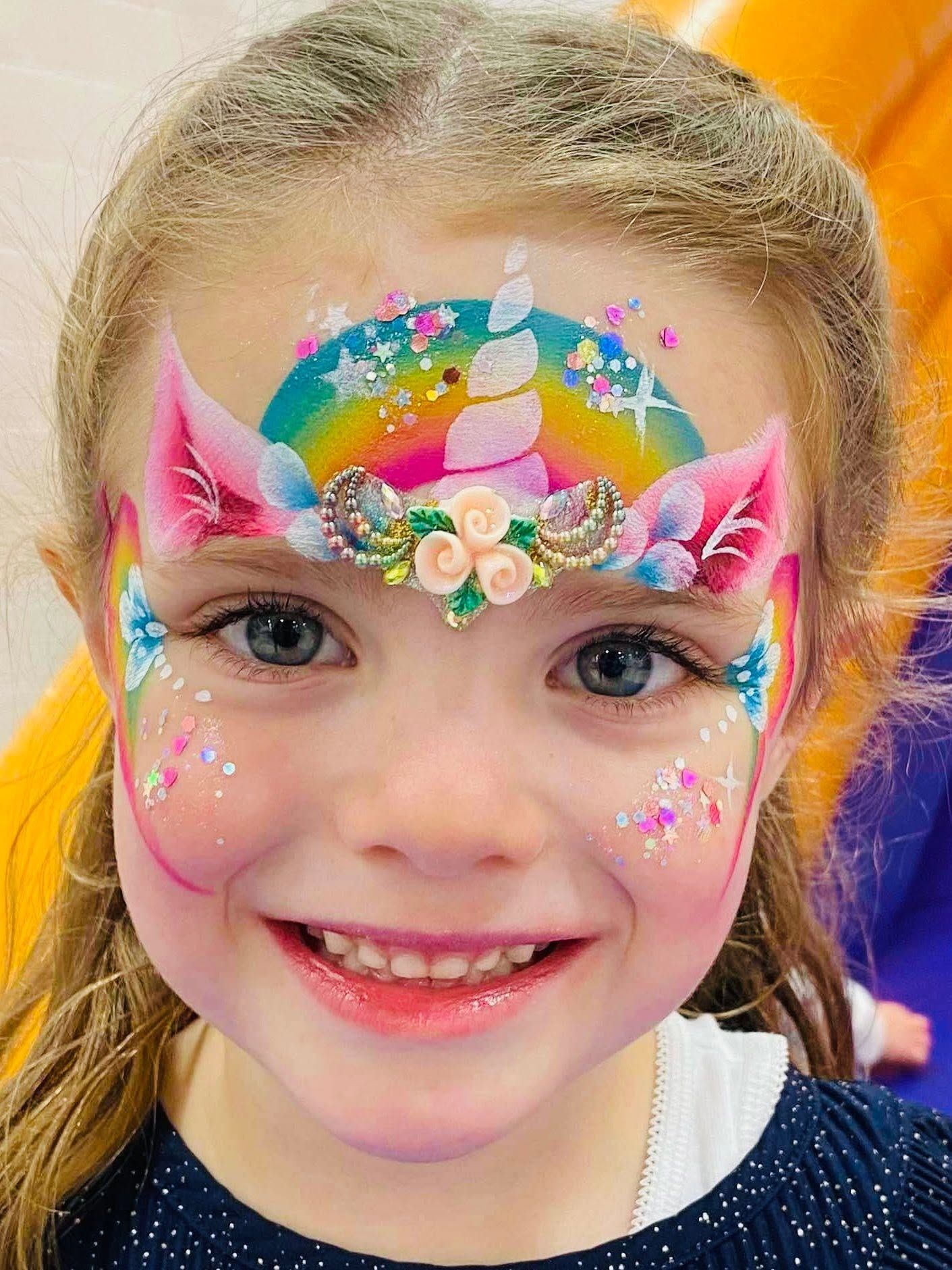 Girl with a rainbow unicorn crown, gold horn and gems, painted by Kerry